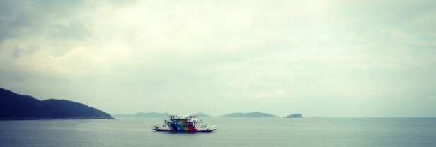 Colorful boat on the waters off the Saemangeum Seawall.